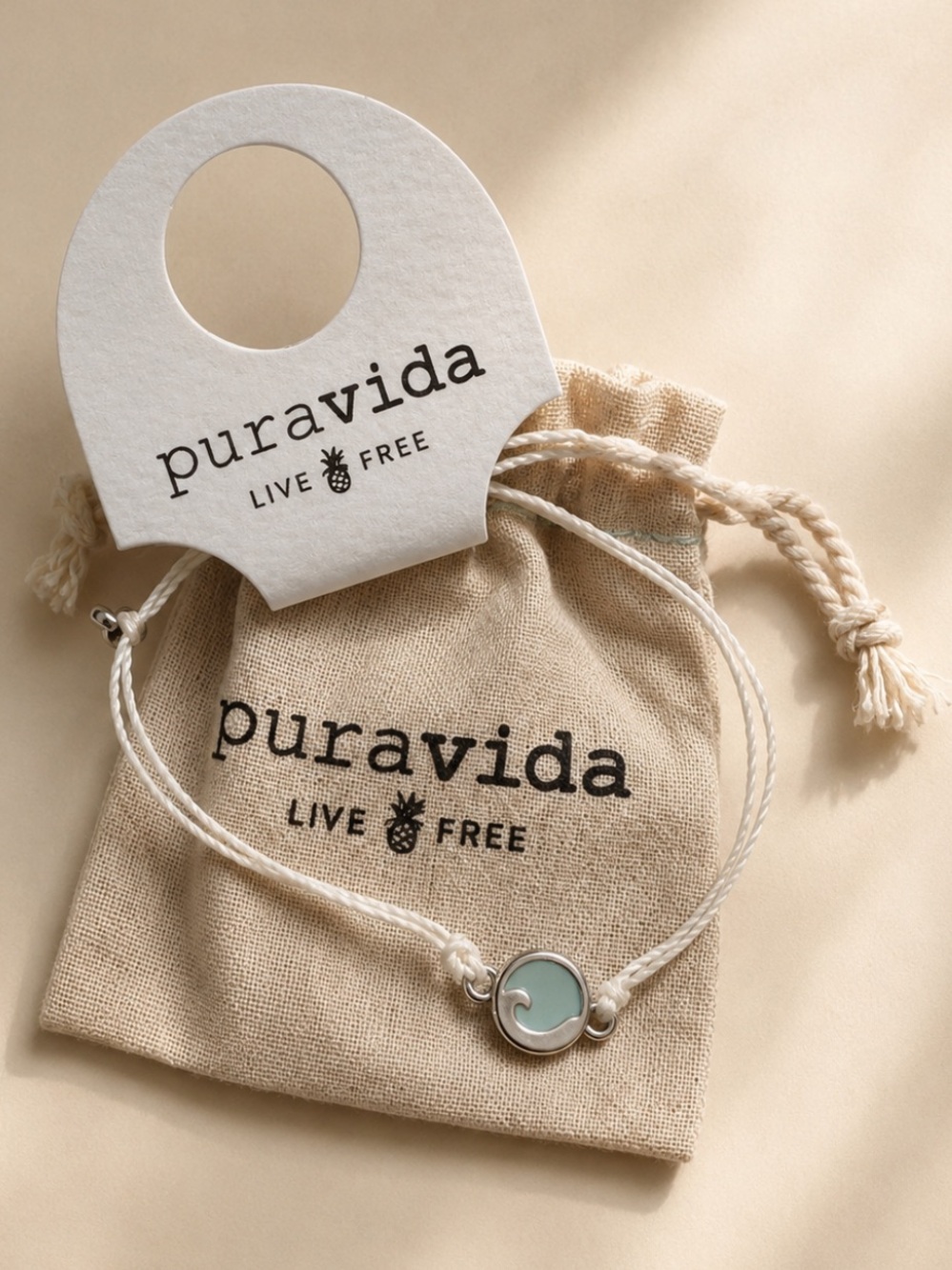 Pura Vida Light Blue Wave Charm Bracelet - White Cord